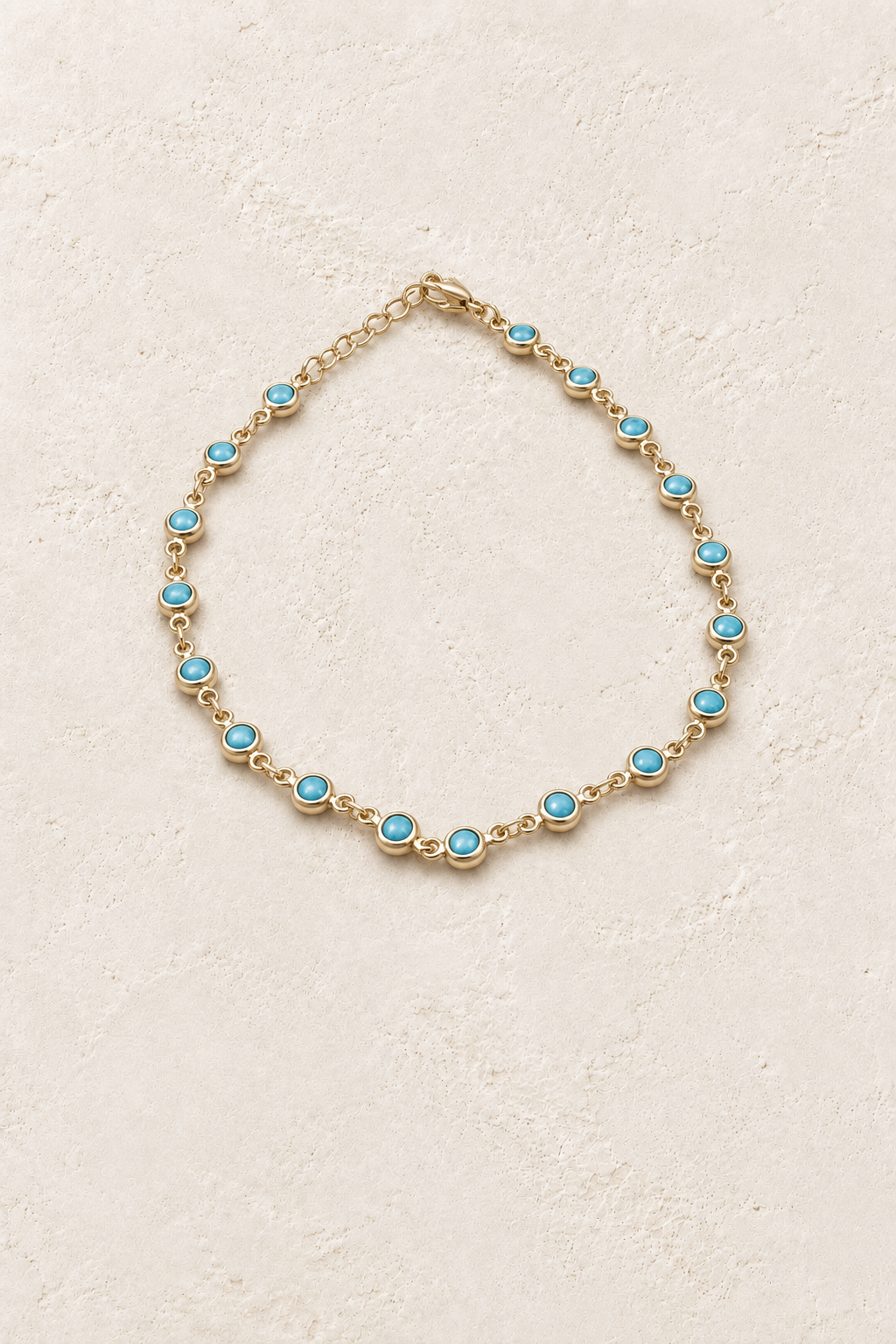 
                  
                    4mm 10inch Turquoise Gold Chain Bracelete TF on Boho & Mala's cream beige textured hero background
                  
                