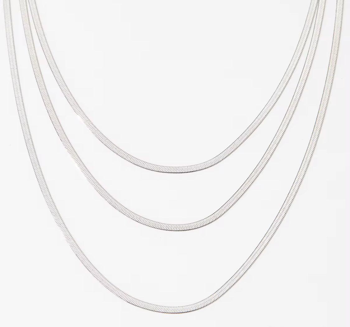 
                  
                    Sienna Silver Triple Layer Herringbone Necklace – Waterproof Stainless Steel
                  
                