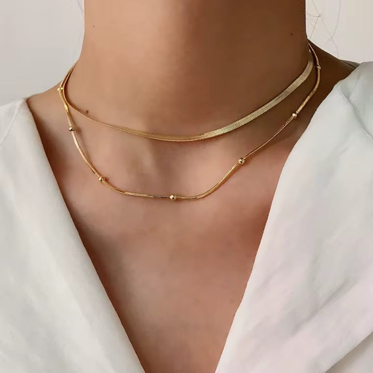 
                  
                    Elara Beaded Double Layer Necklace – Waterproof Gold-Plated Stainless Steel
                  
                