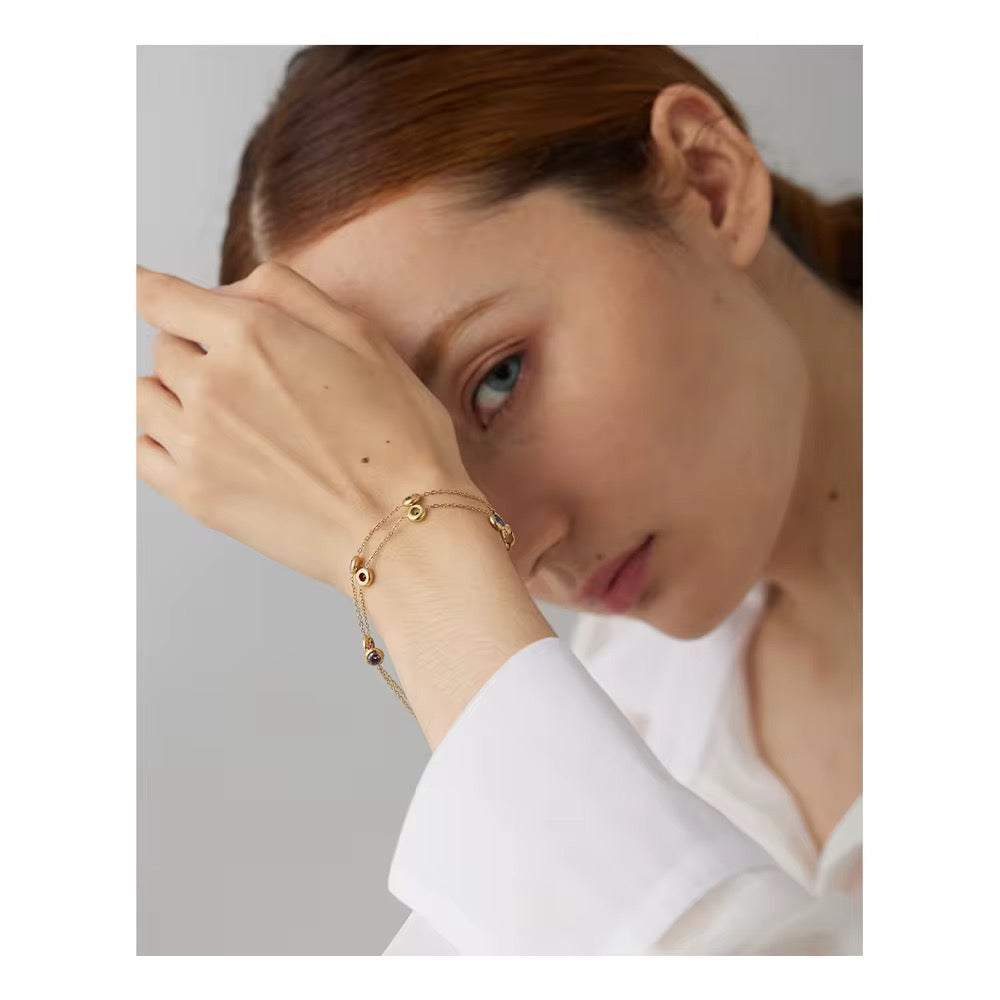 Rainbow Crystal Gold Bracelet worn on a model's wrist