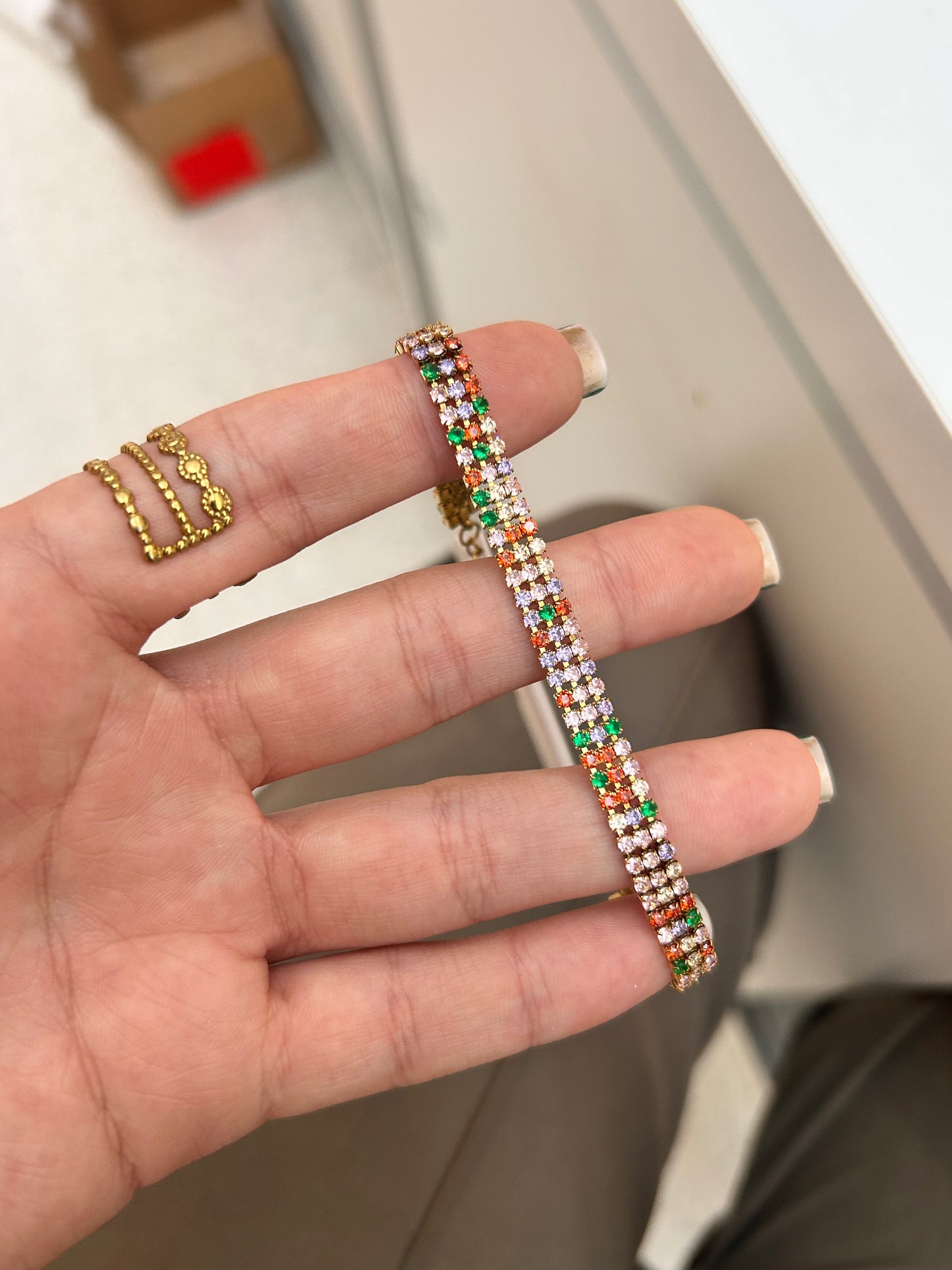
                  
                    Luciana Gold Triple Row Multicolour Tennis Bracelet original product detail photograph
                  
                