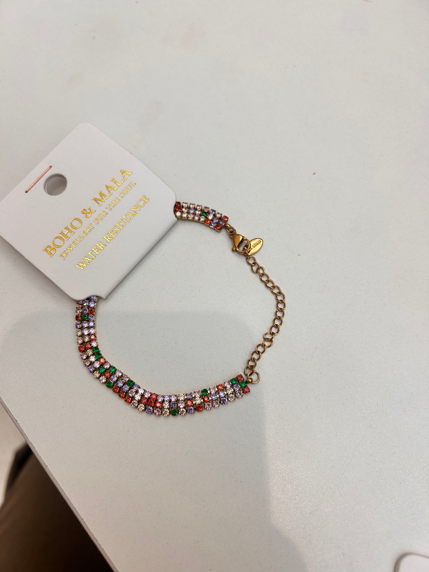 
                  
                    Luciana Gold Triple Row Multicolour Tennis Bracelet original product detail photograph
                  
                