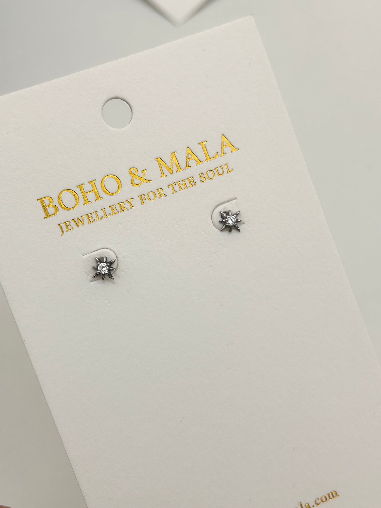 
                  
                    Estelle Silver Starburst Stud Earrings
                  
                