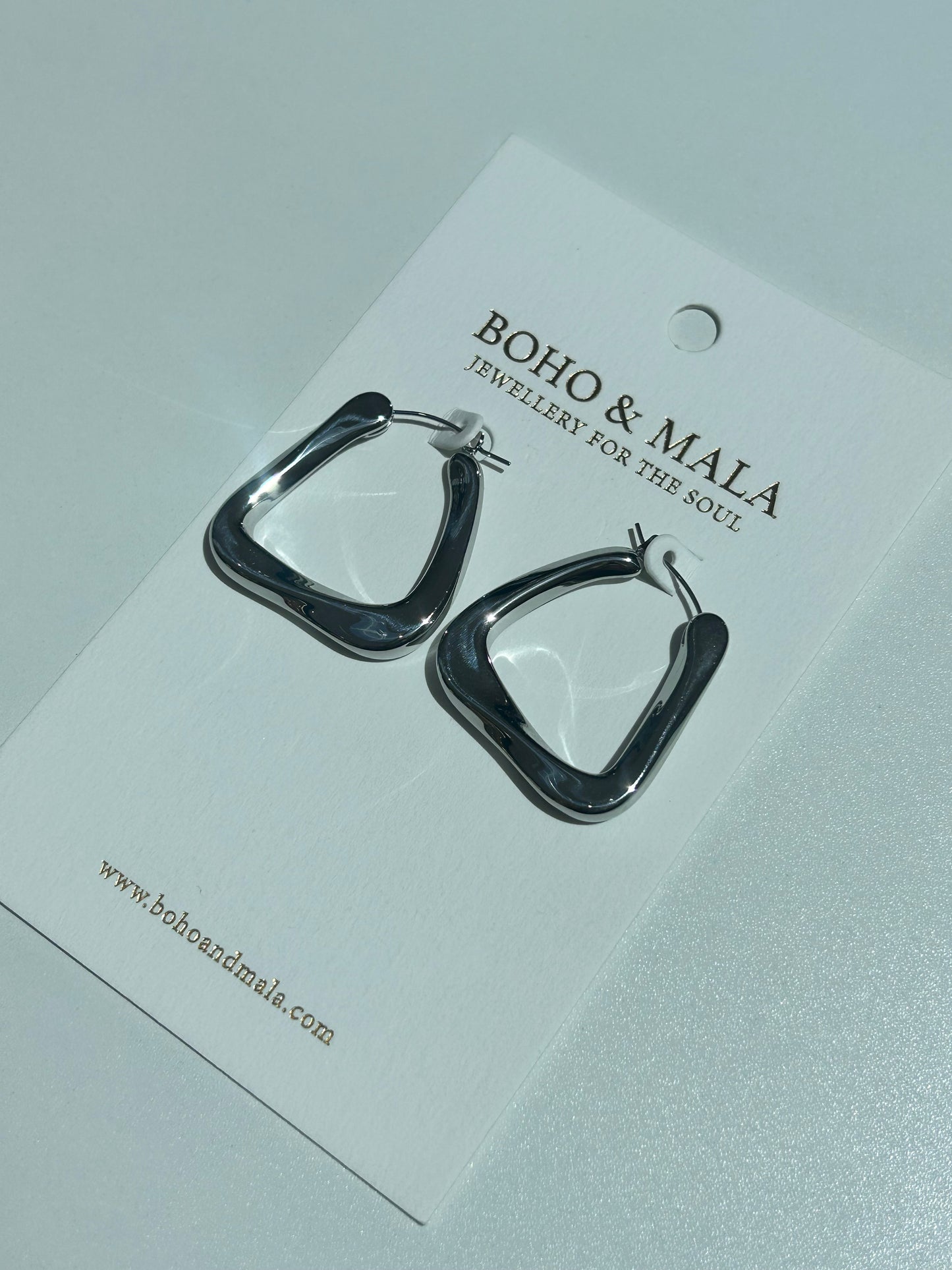 
                  
                    Tavia Silver Organic Triangle Hoop Earrings
                  
                