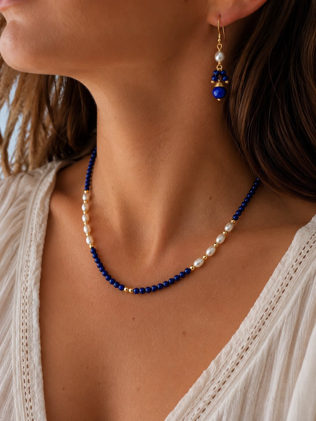 
                  
                    Matching lapis lazuli drop earrings with freshwater pearls and  matching beaded lapis lazuli necklace also with freshwater pearls 
                  
                