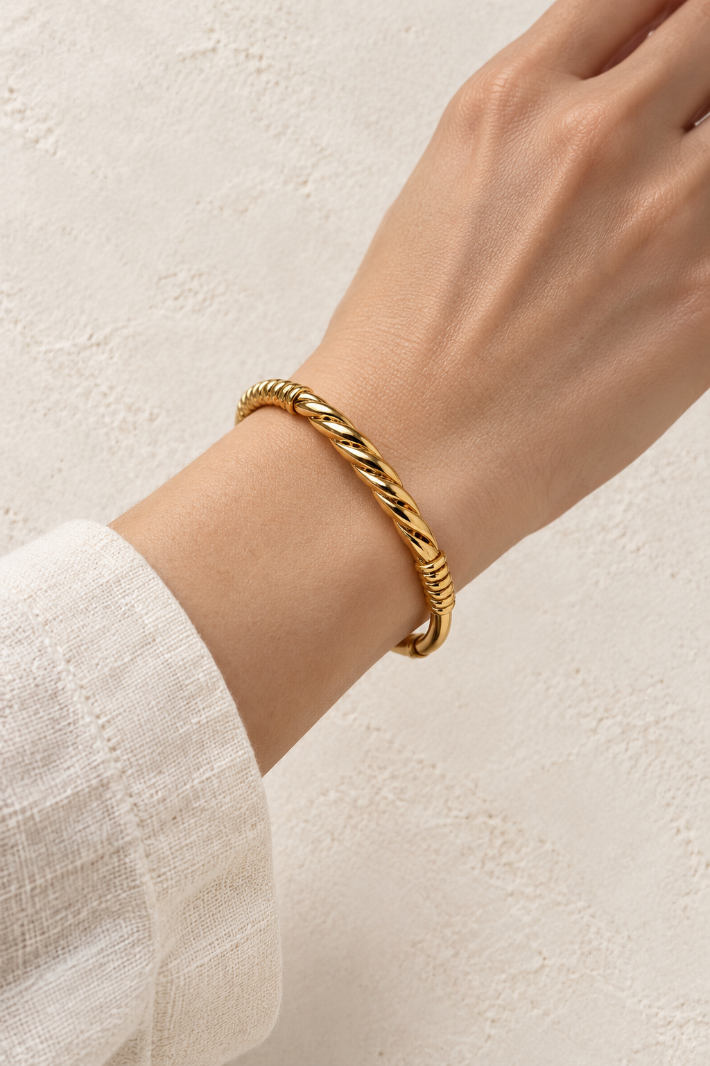 
                  
                    Model wearing Alessia Gold Diagonal Ribbed Bangle
                  
                