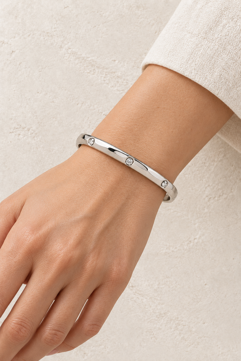 
                  
                    Model wearing Amelie Silver Crystal Station Bangle
                  
                
