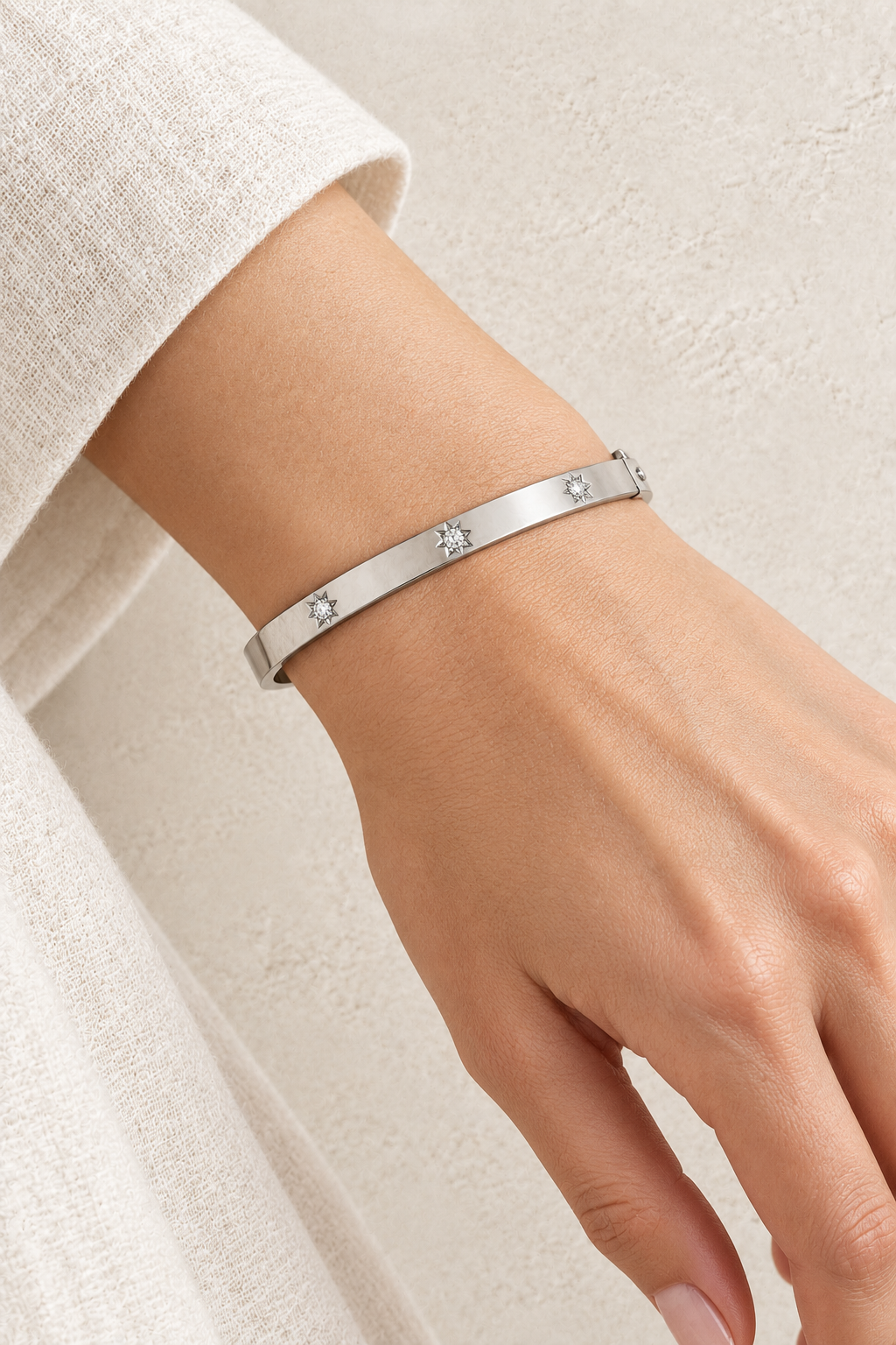 
                  
                    Model wearing Aster Silver Diamond Motif Bangle
                  
                