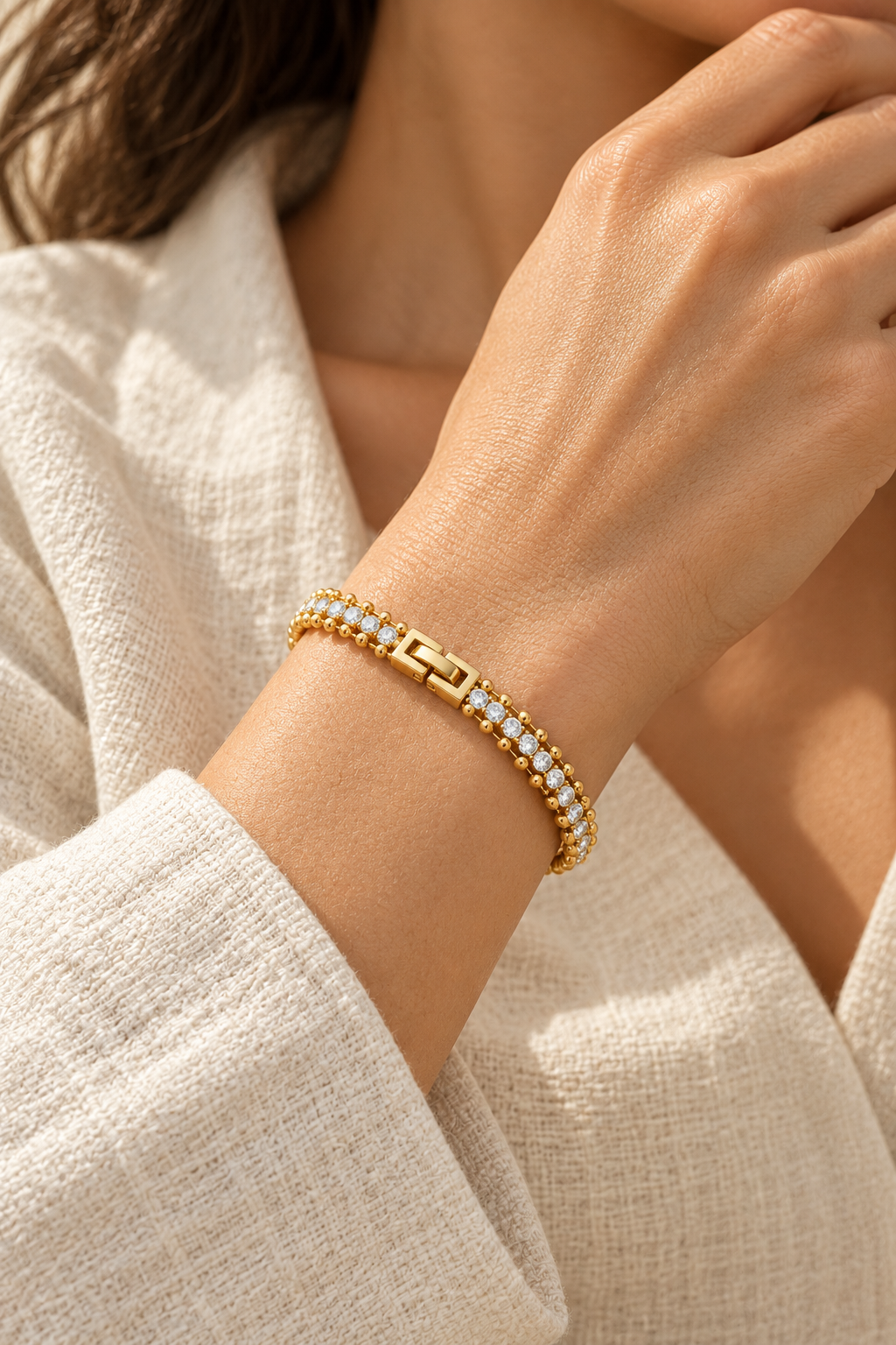 Aurora Crystal Beaded Gold Tennis Bracelet worn on a model's wrist