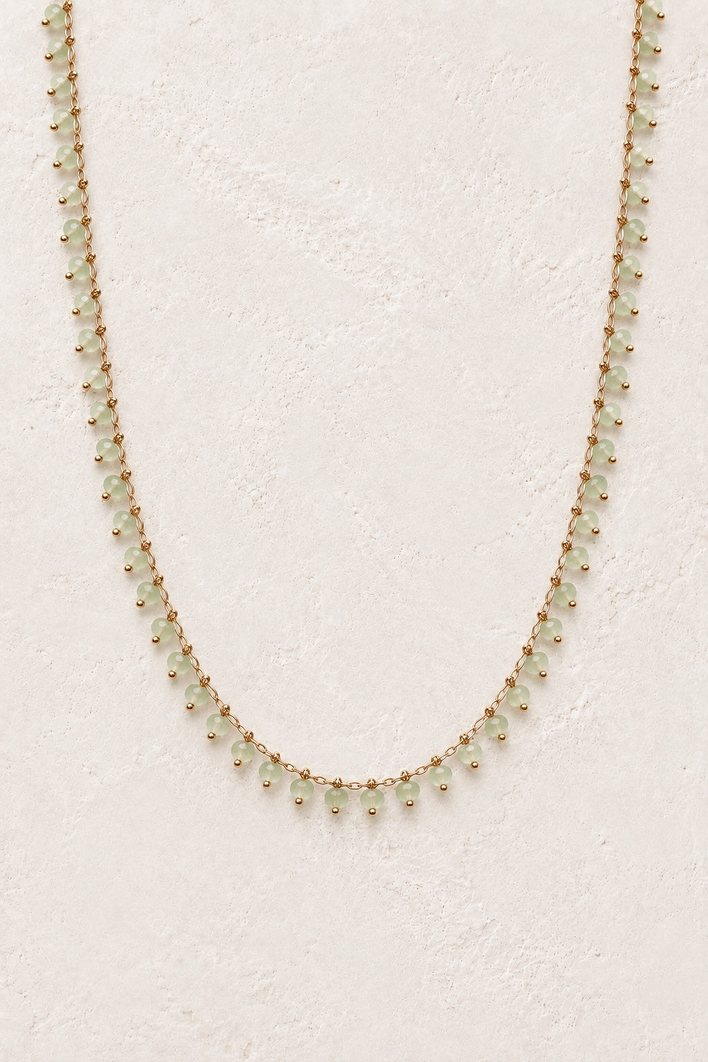 Avelora Prehnite gemstone drop necklace on a light neutral background
