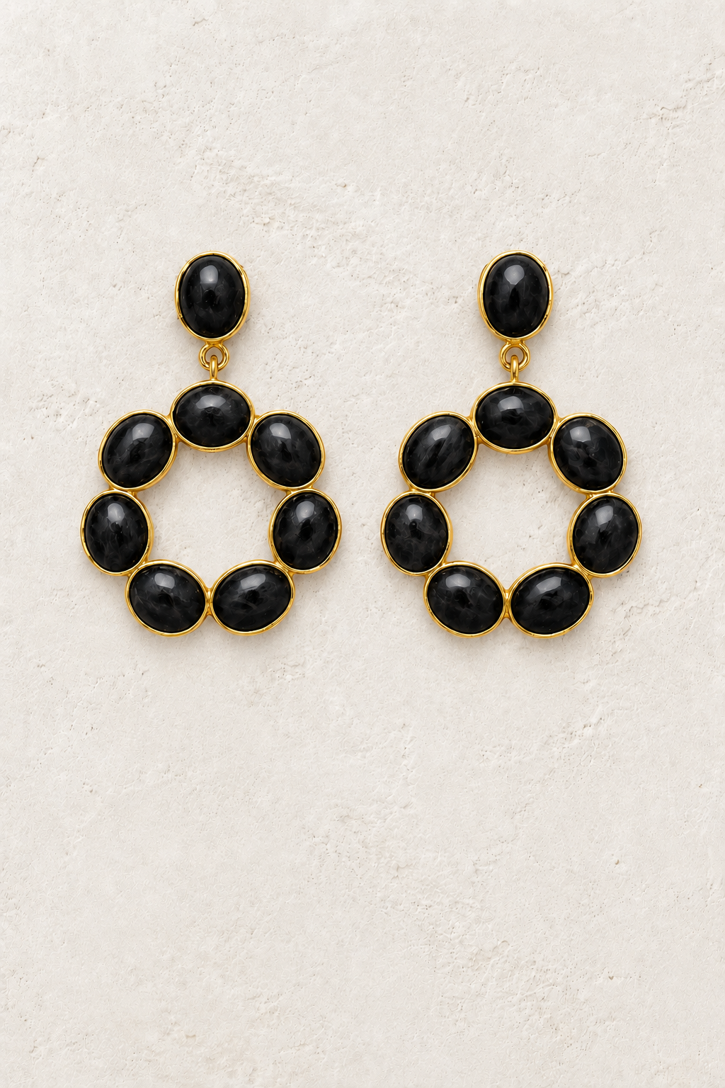 
                  
                    Black Obsidian Soul genuine gemstone statement earrings on cream textured background
                  
                