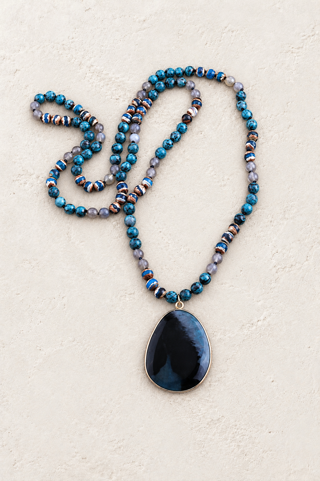
                  
                    Midnight Blue Tribal Stone Necklace on Francesca's approved original hero background
                  
                