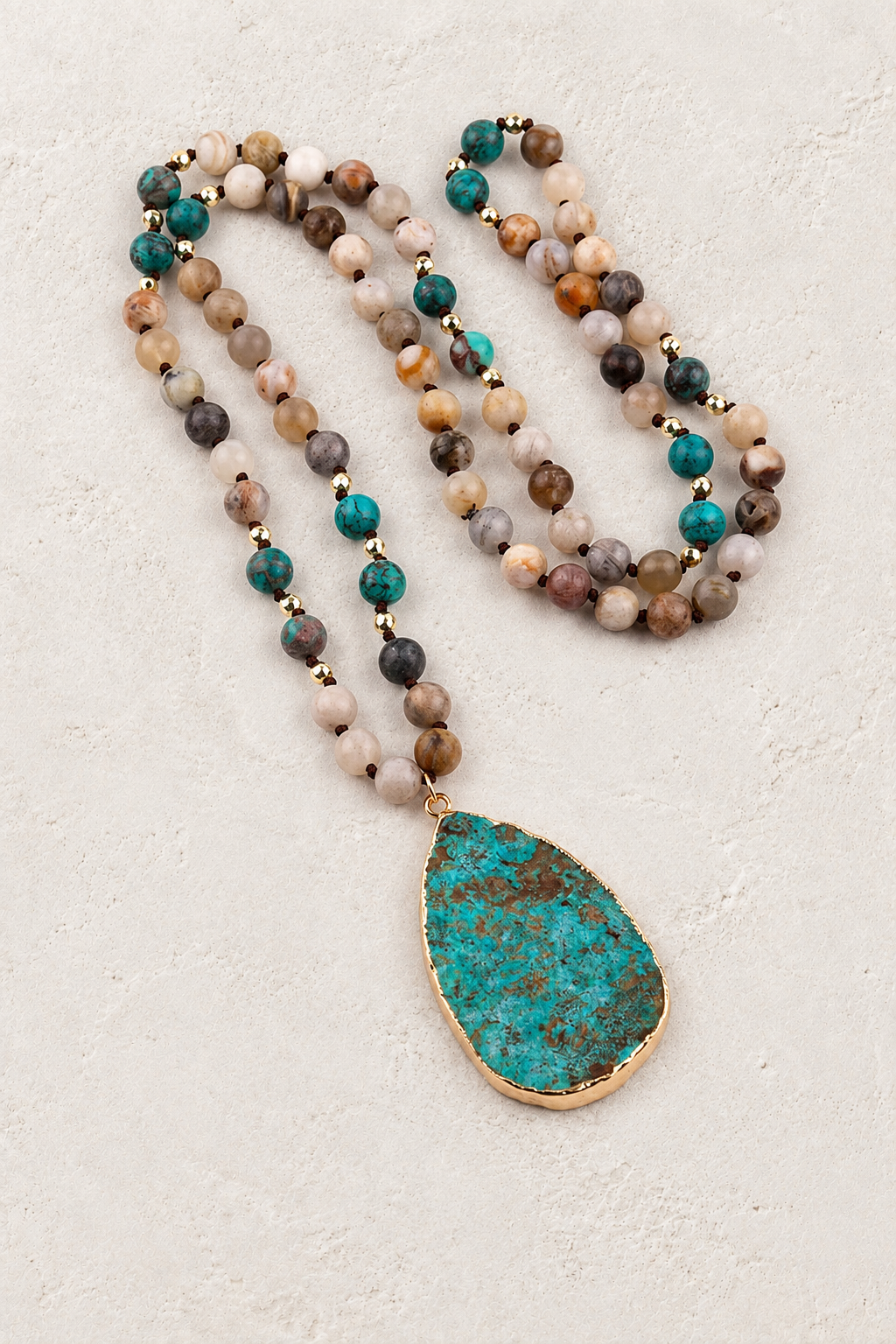 
                  
                    Canyon Tribal Teardrop Necklace on Francesca's approved original hero background
                  
                