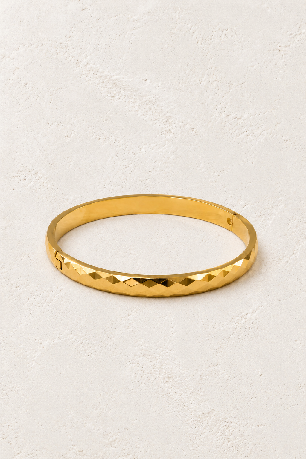 
                  
                    Valora Faceted Gold Bangle on Francesca's supplied original hero background
                  
                