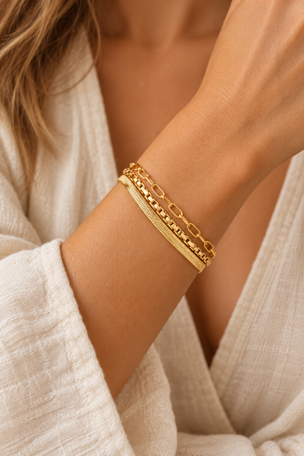 Boho model wearing the gold triple-chain bracelet