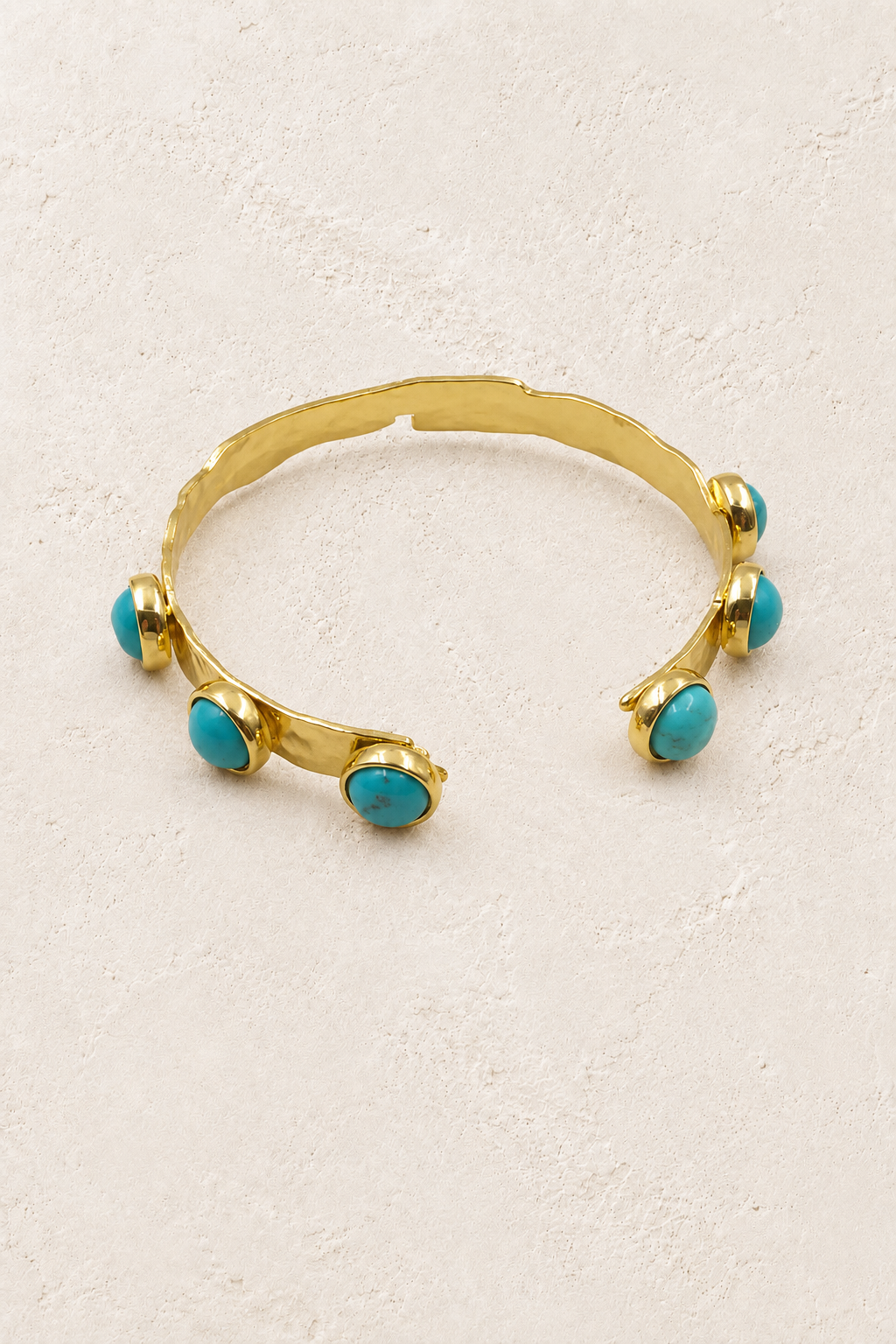 
                  
                    Boho & Mala Turquoise Gold Cuff Bracelet DCB1009 on Boho & Mala's cream beige textured hero background
                  
                