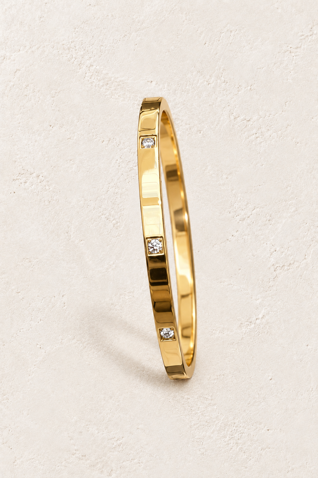 
                  
                    Gold Square Crystal Bangle | Waterproof on ivory textured background
                  
                