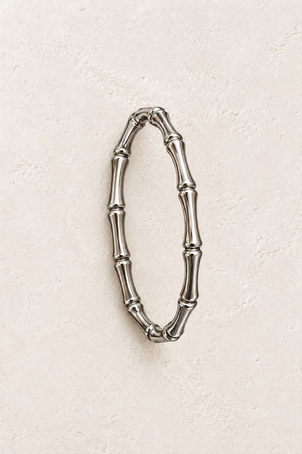 
                  
                    Silver Bamboo Style Bangle | Waterproof on ivory textured background
                  
                