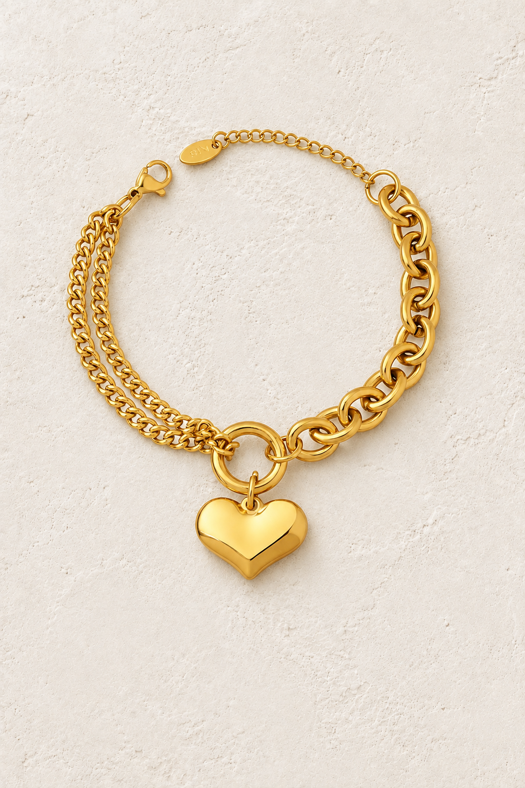 
                  
                    Amour Gold Heart Chain Bracelet on ivory textured background
                  
                