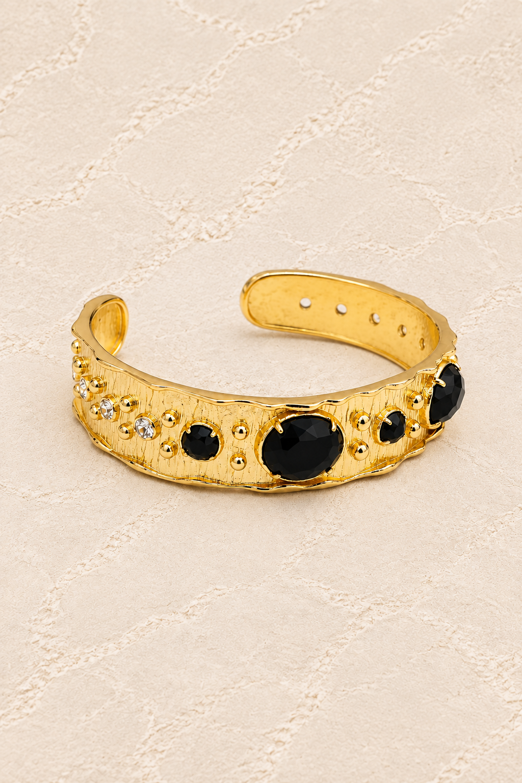 
                  
                    Black Obsidian Solara Cuff Bracelet on ivory plaster, tall product cover
                  
                