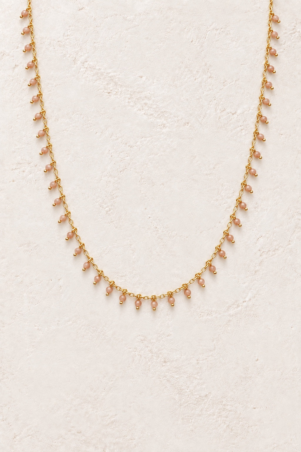 Calista Sunstone gemstone drop necklace on a light background