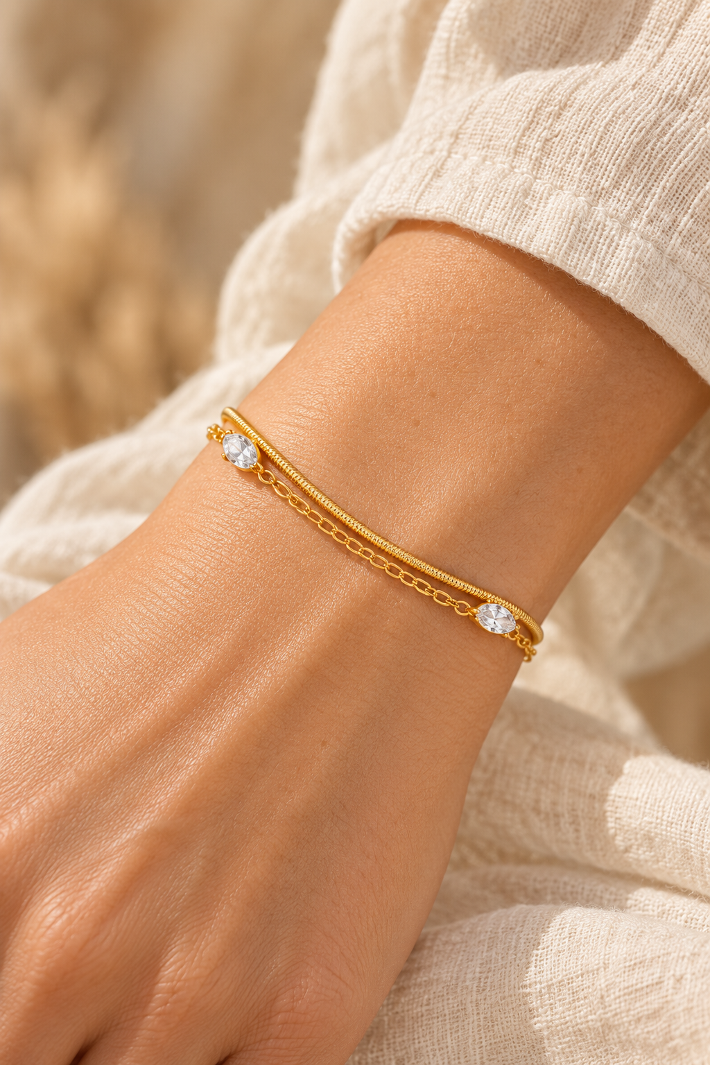 Celeste Gold Crystal Layered Bracelet worn on a model's wrist