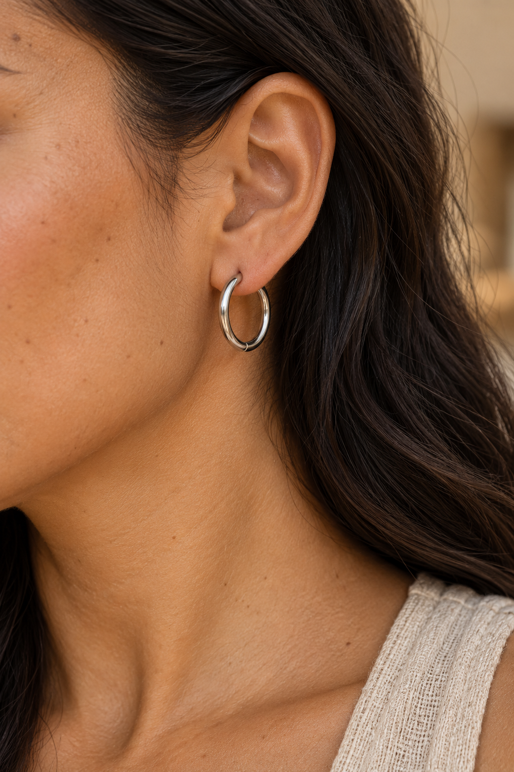 
                  
                    Close-up of Classic Waterproof Hoop Earrings – Silver 20mm worn on a boho chic model
                  
                