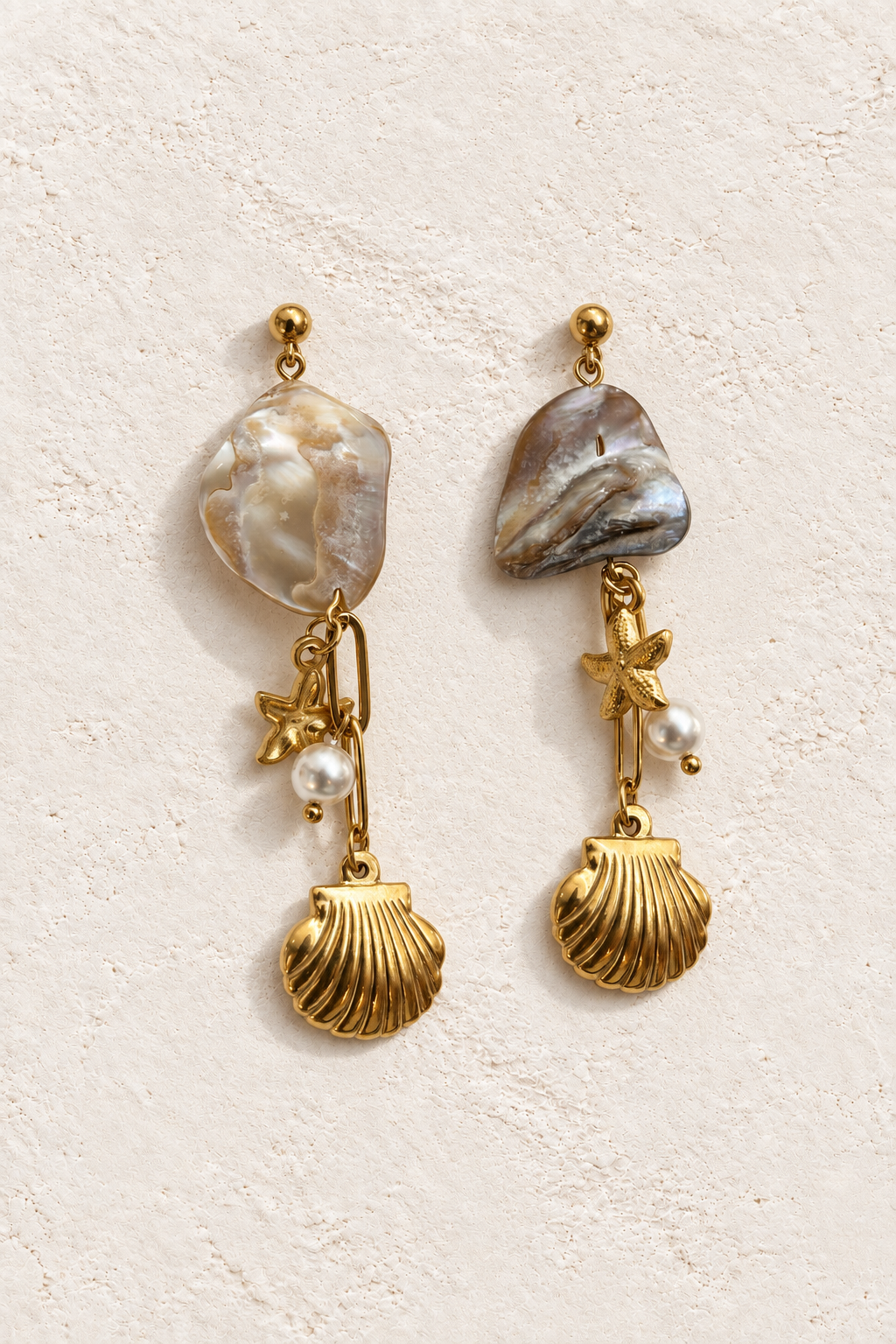 Coraline Ocean Charm Drops on warm ivory textured background