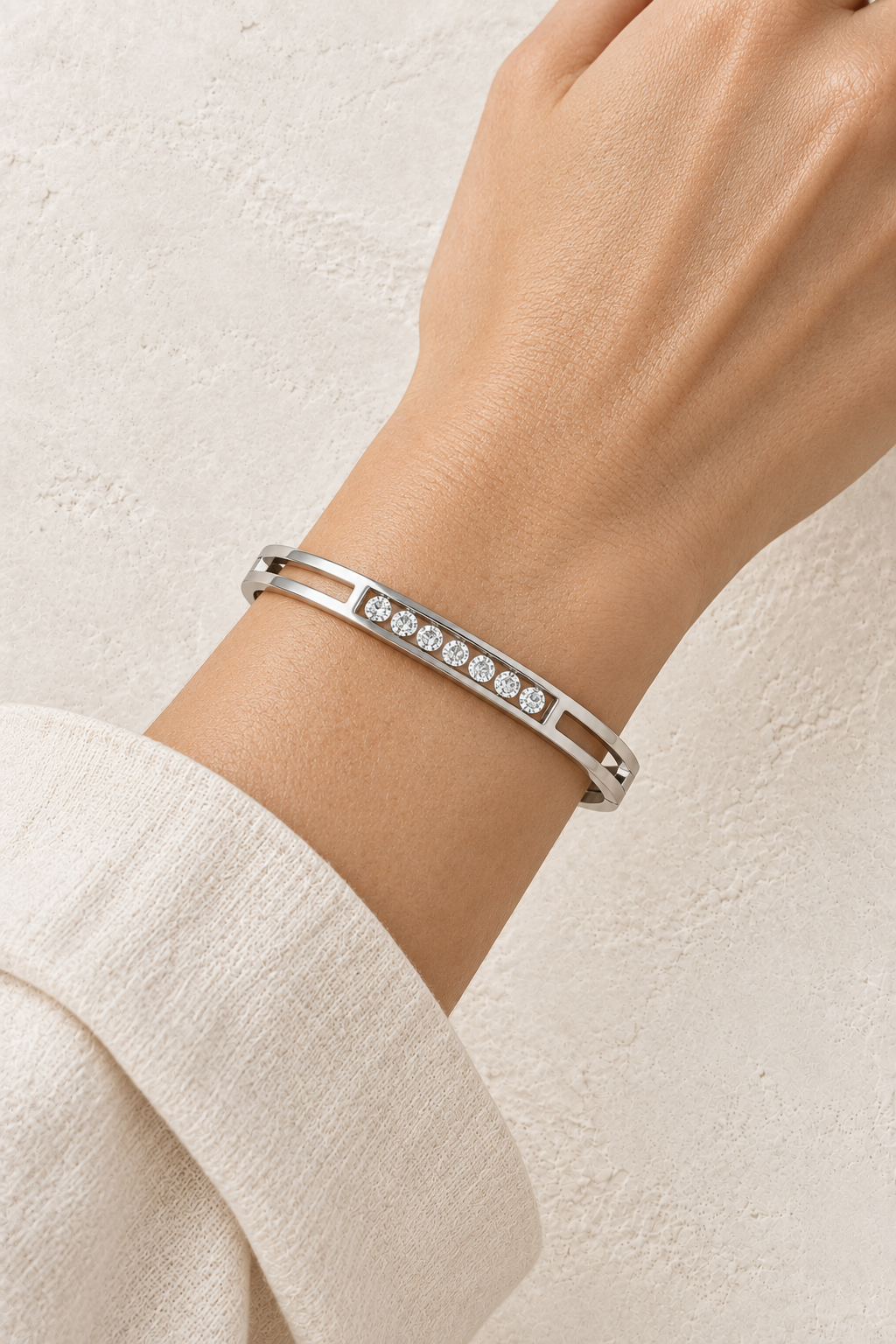 
                  
                    Model wearing Elira Silver Double Row Crystal Bangle
                  
                