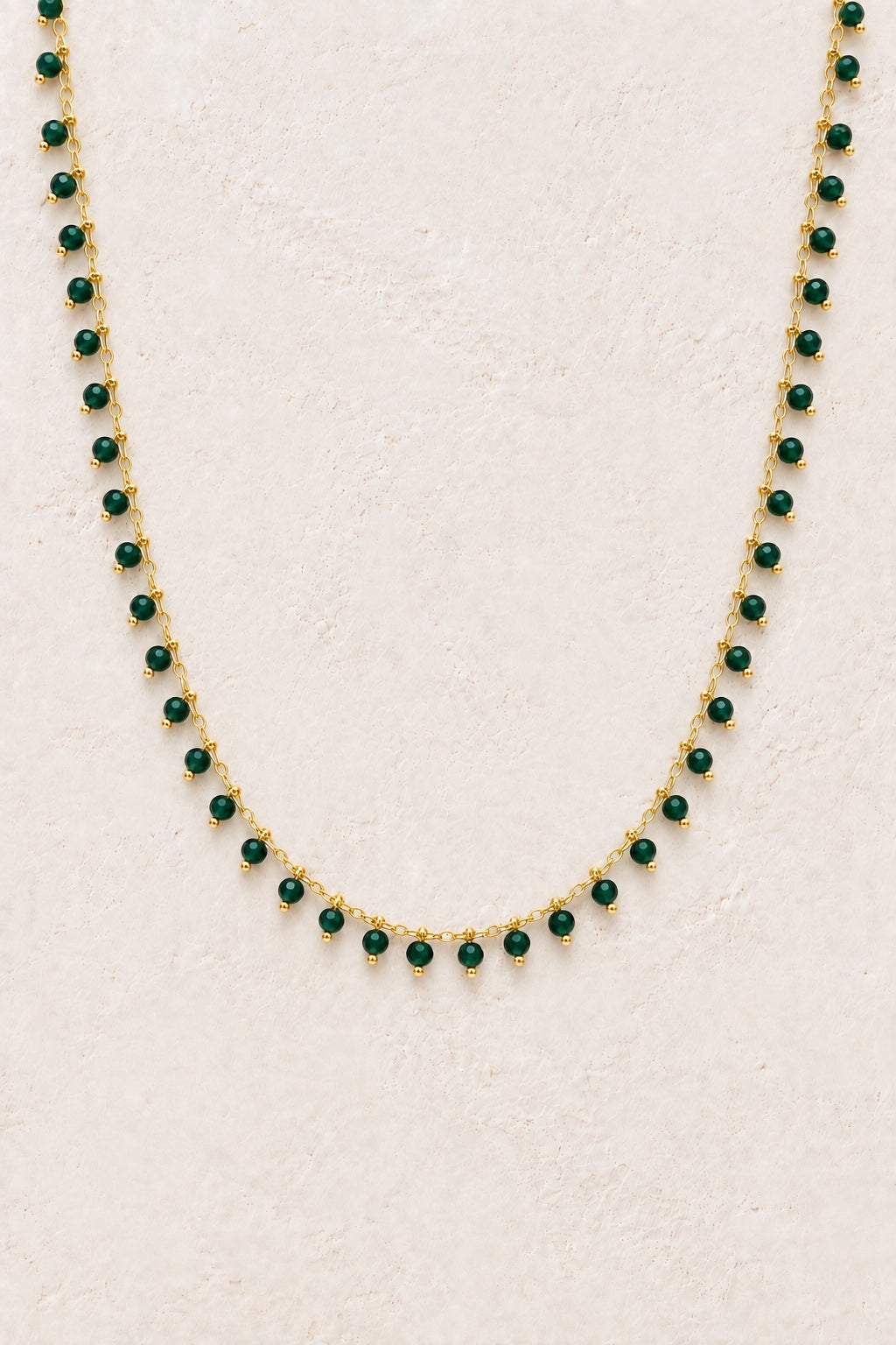 Evora Green Jade gemstone drop necklace on a light neutral background