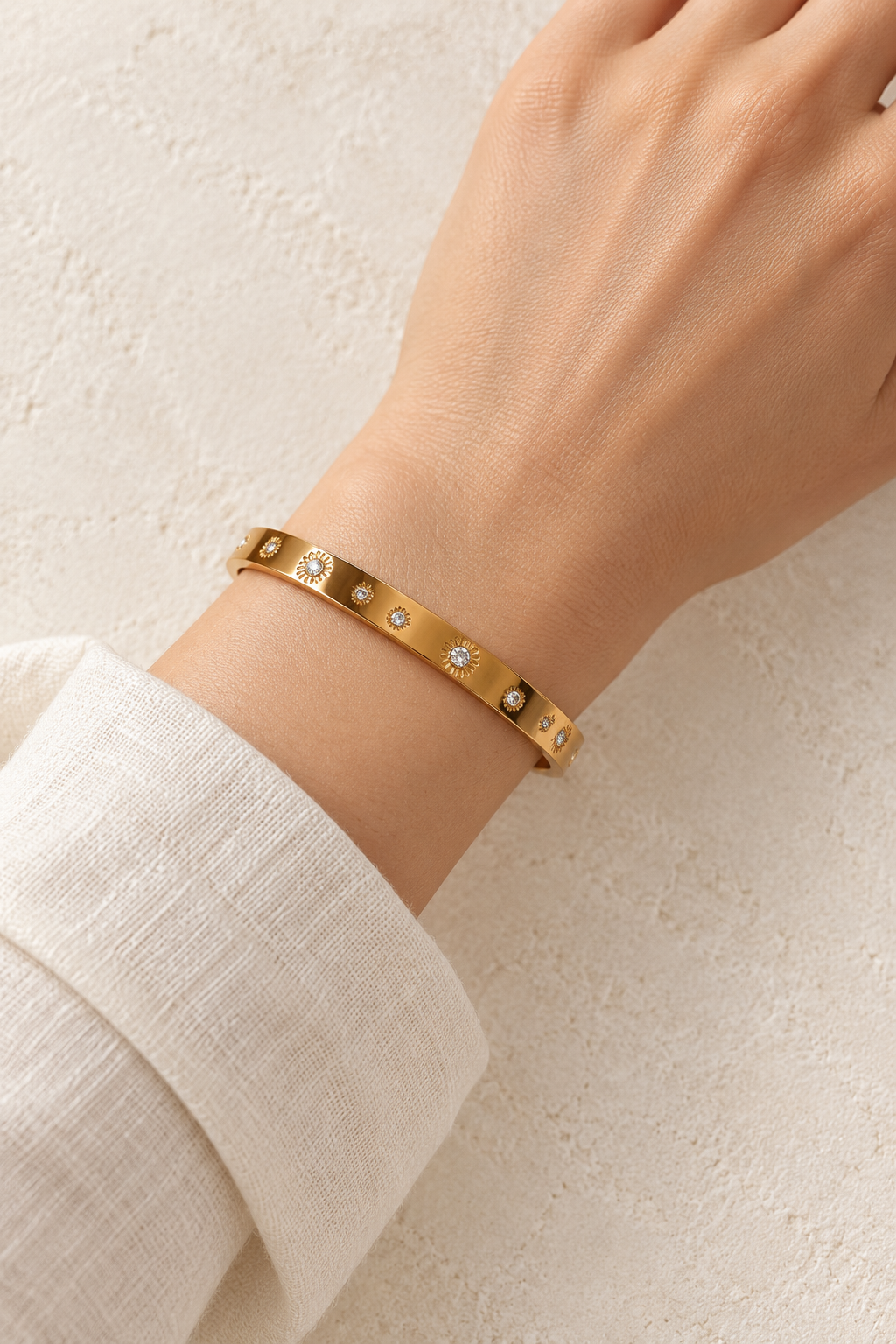 
                  
                    Model wearing Flora Sunflower Gold Bangle
                  
                