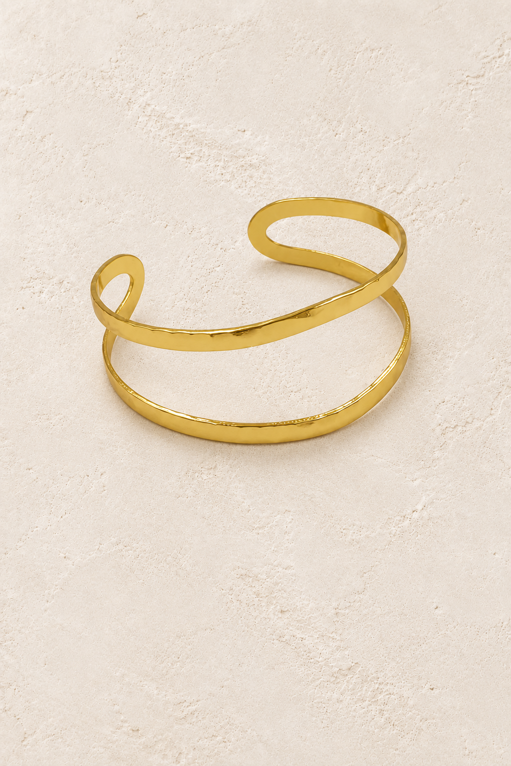 Free Spirit Boho Brass & Gold Cuff Bracelet on cream beige textured background
