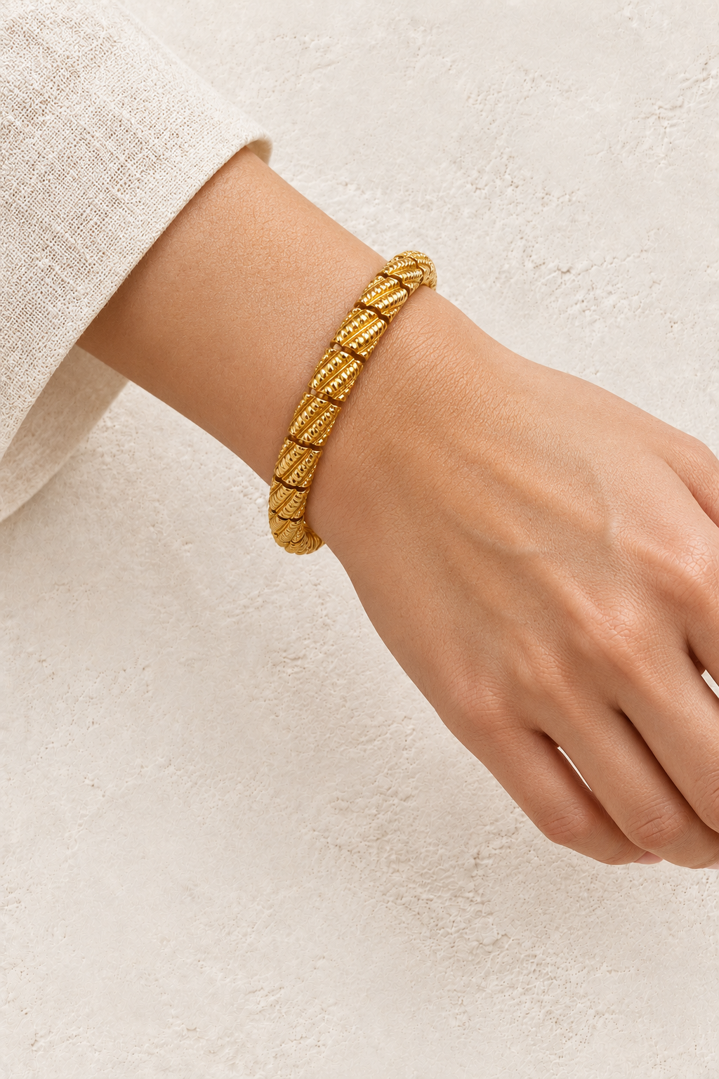 
                  
                    Model wearing Gold Textured Segmented Bangle | Waterproof
                  
                