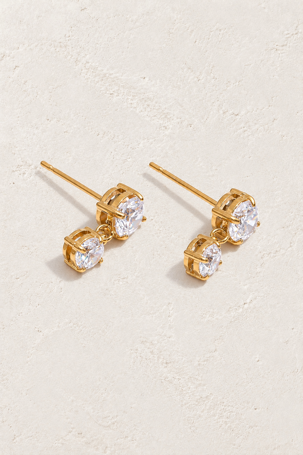 
                  
                    Gold Clear Crystal Duo Drop Stud Earrings — original cream plaster hero
                  
                