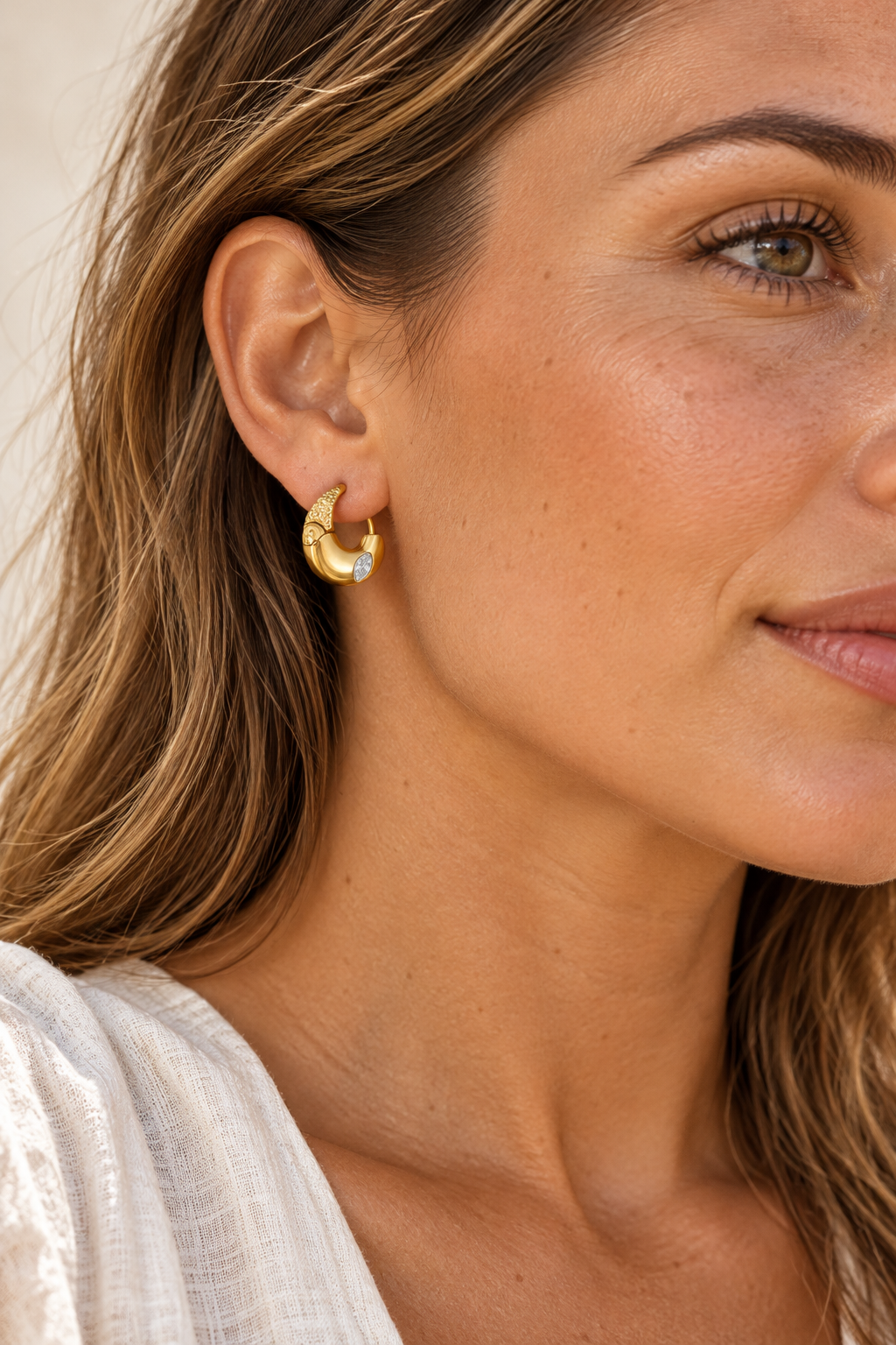 Gold Marquise Inset Crystal Hoop Earrings worn on a model
