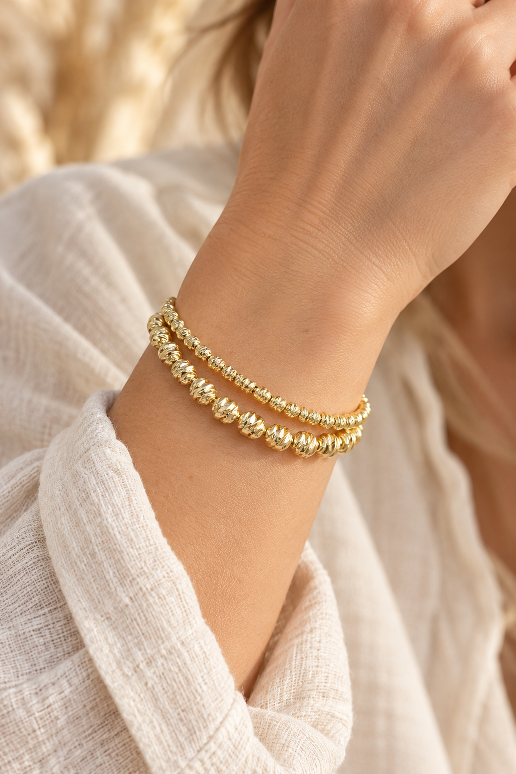 Gold Plated Double Textured Twin Bracelet Set worn on a model's wrist