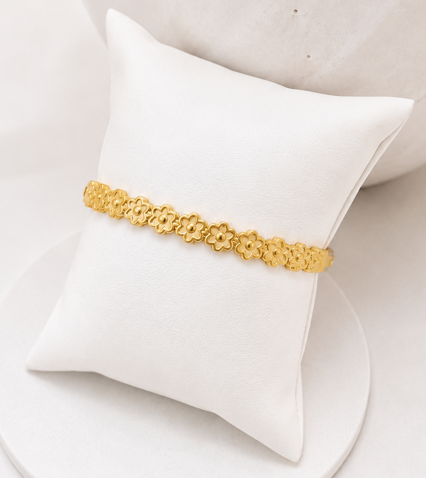 Gold waterproof flower bracelet with delicate floral links in PVD gold-plated stainless steel, tarnish-free everyday jewellery by Boho & Mala.