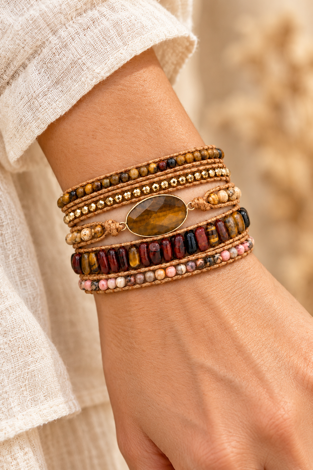 
                  
                    Handmade Tiger’s Eye Mixed Natural Stone Wrap Bracelet worn on a model's wrist
                  
                