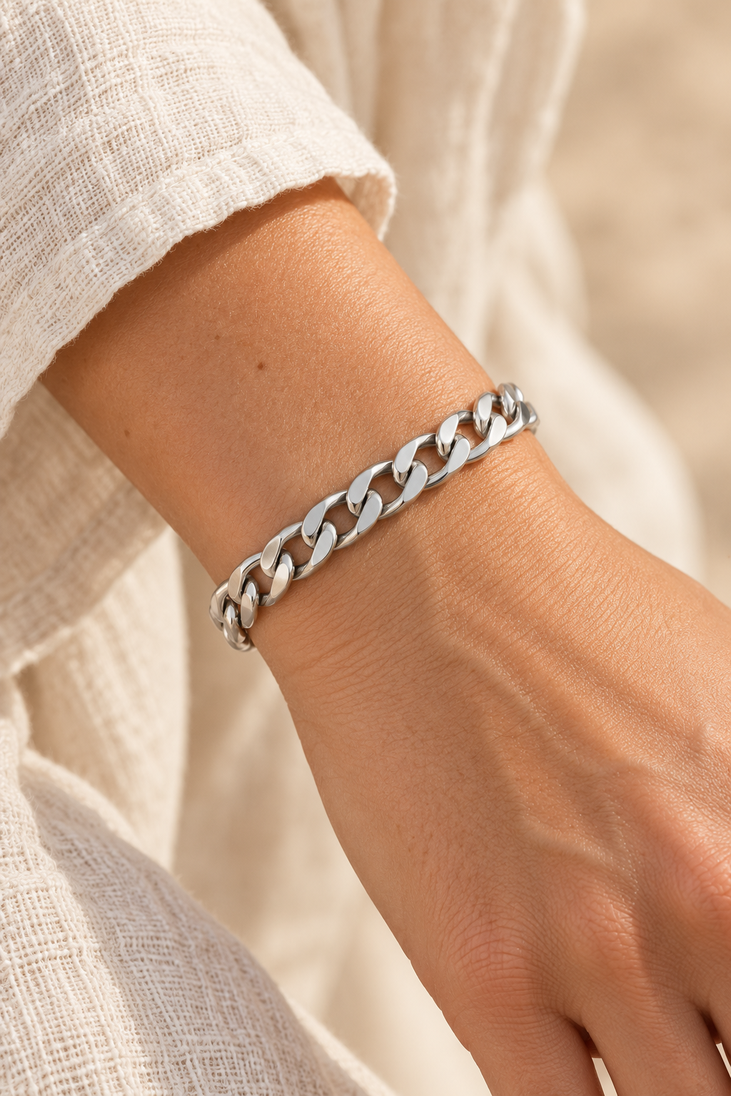 
                  
                    Harlow Silver Curb Link Bracelet worn on a model's wrist
                  
                