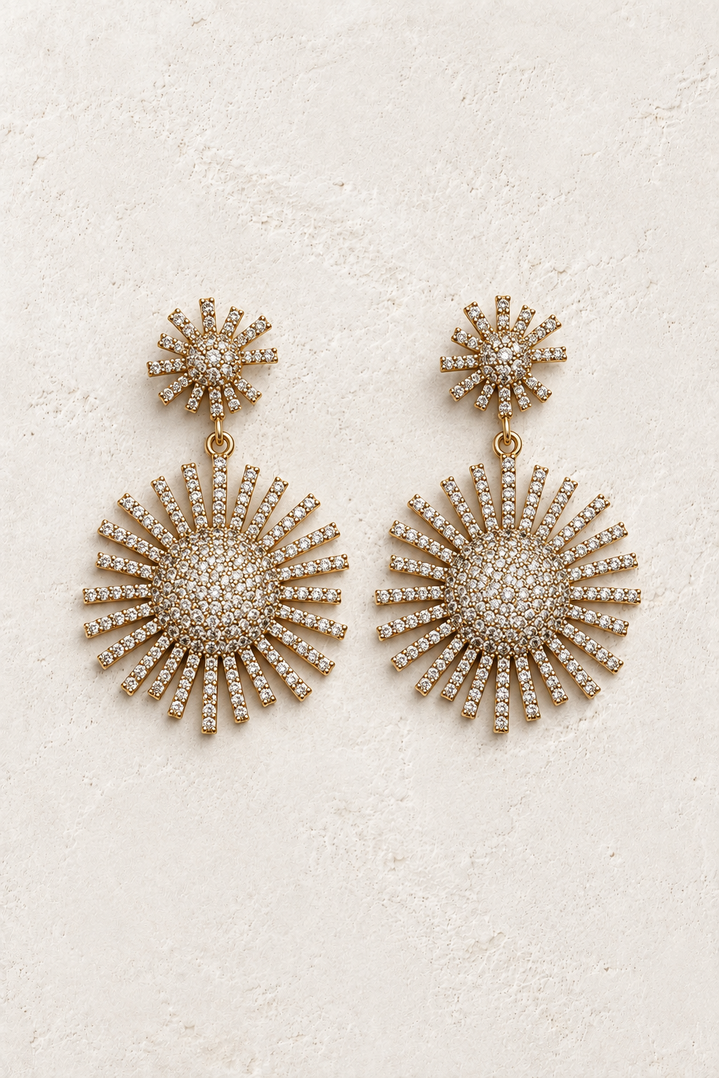 
                  
                    Helia Crystal Sunburst Drop Earrings – Gold on cream textured background
                  
                