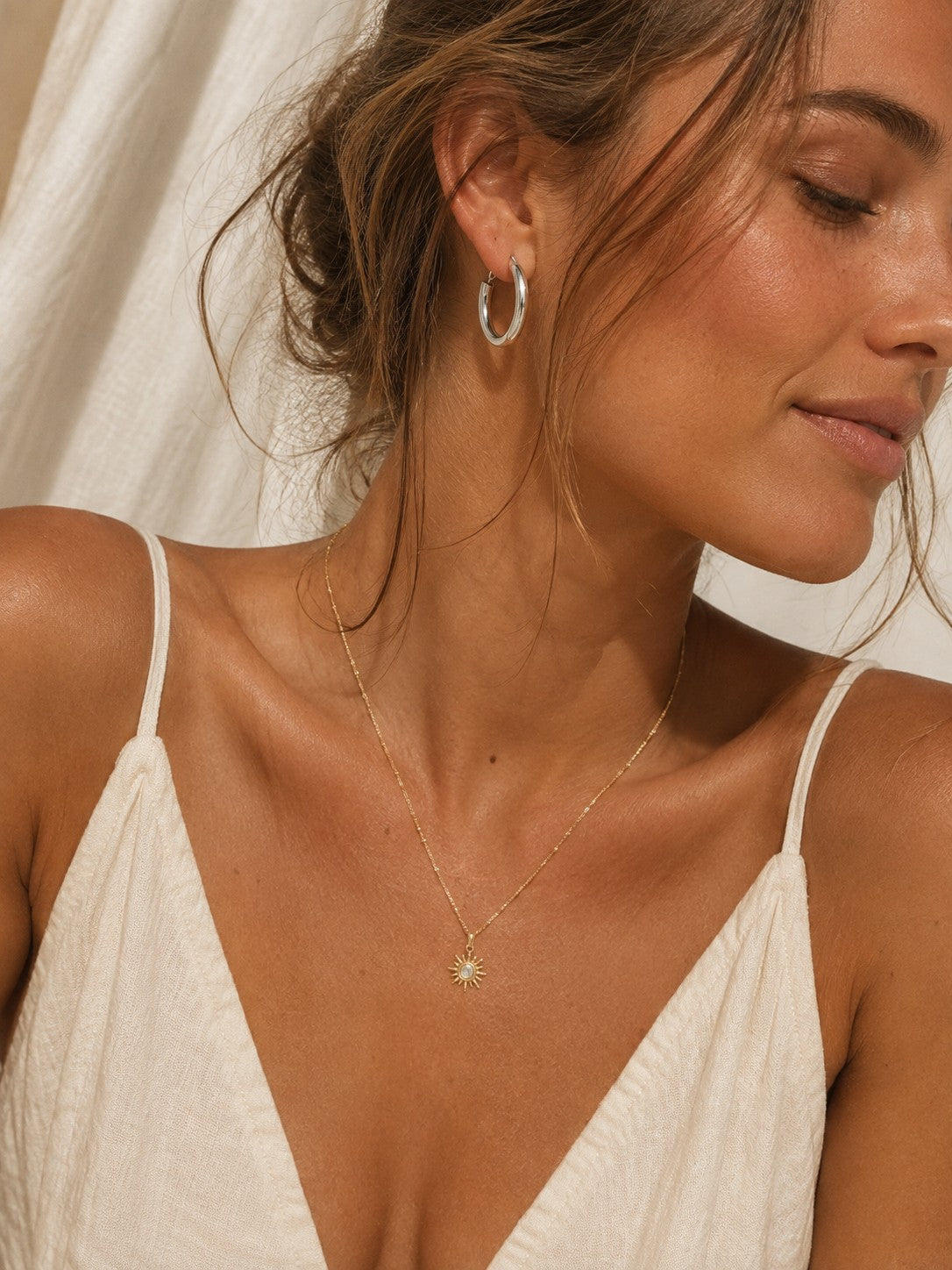 
                  
                    Silver chunky hoop earring styled on model
                  
                