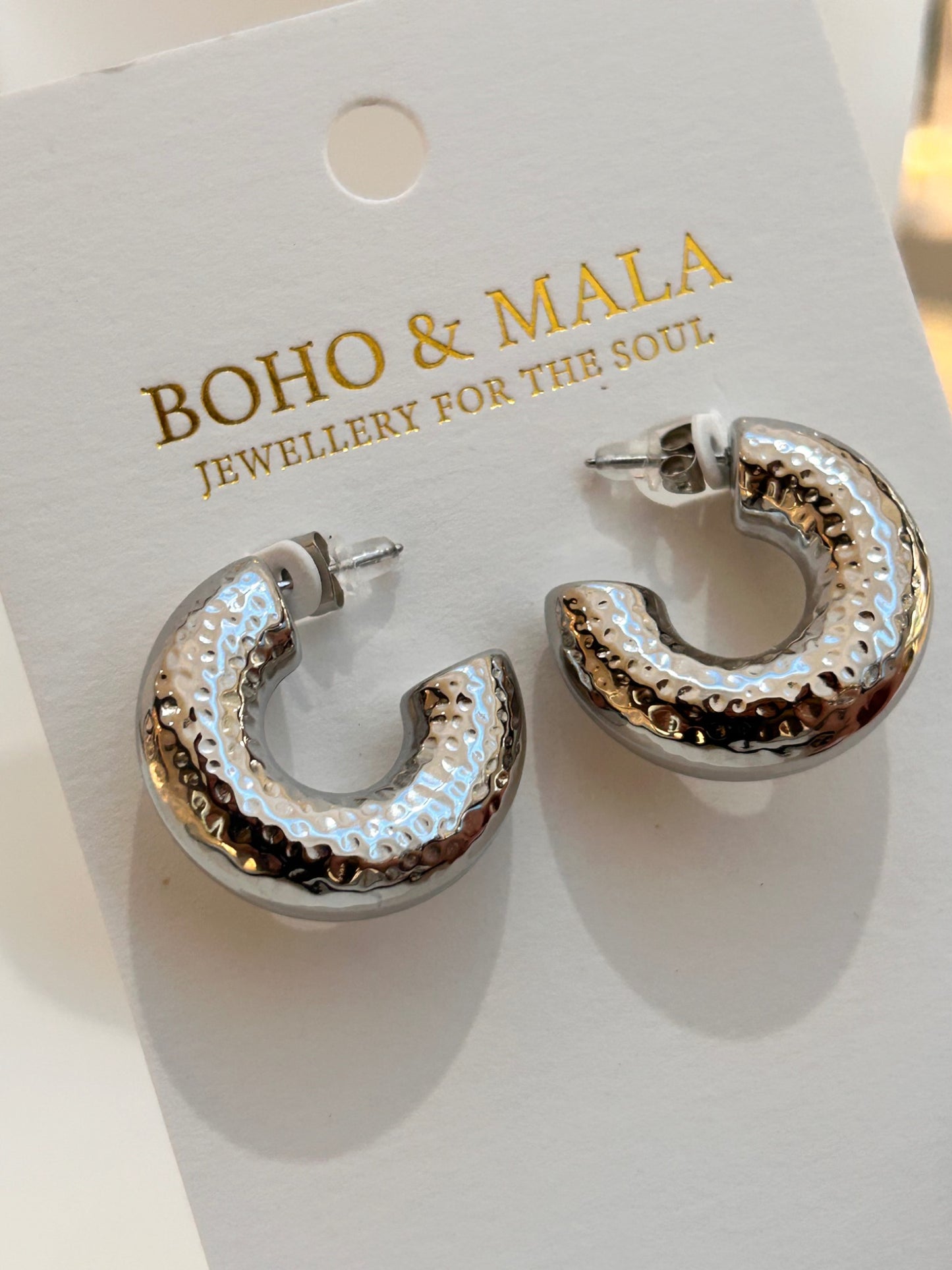 
                  
                    Kaia Hammered Silver Hoops on Boho & Mala display card
                  
                