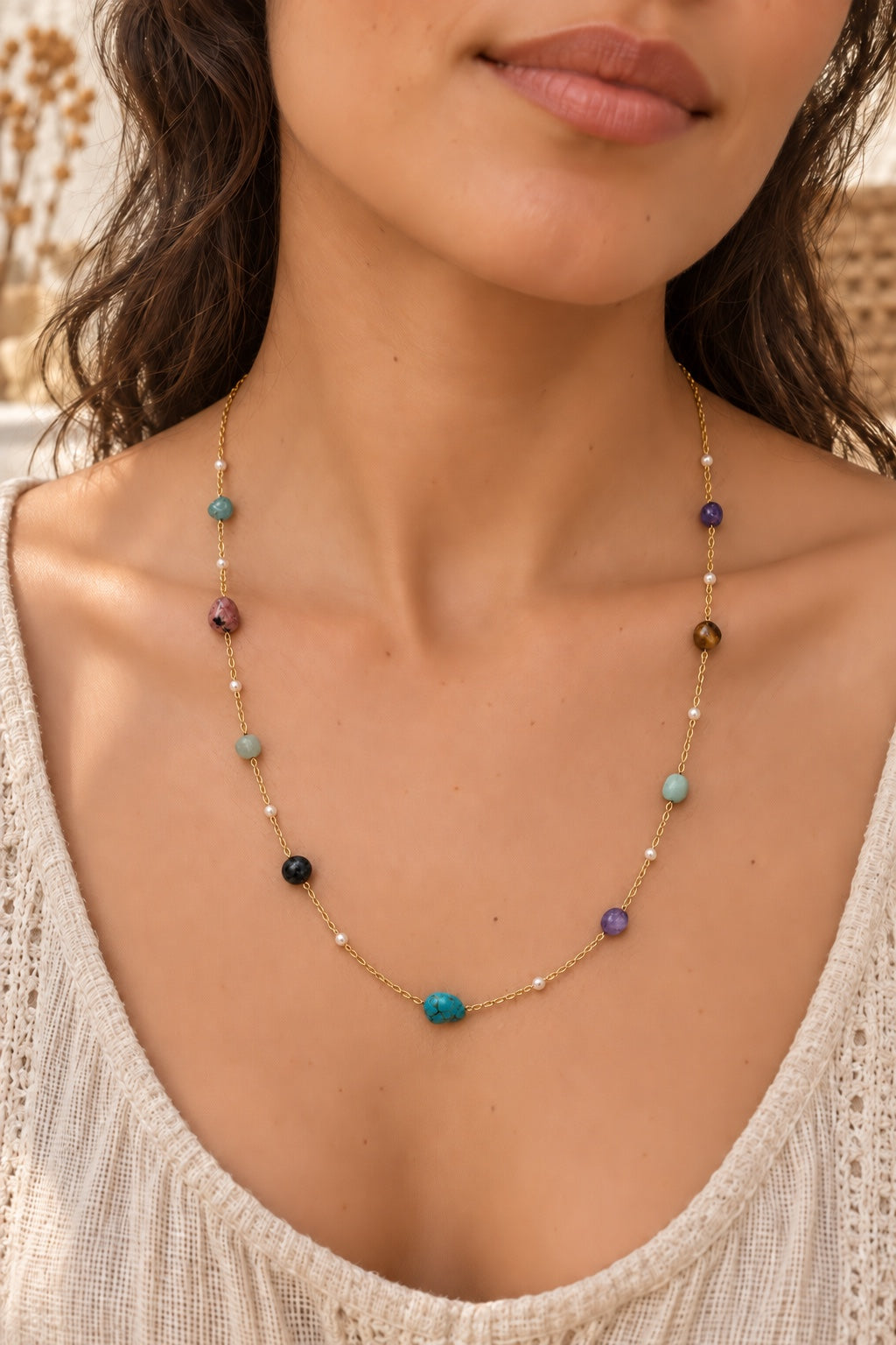 
                  
                    Boho model wearing the Kaleida Mixed Stone gold-plated necklace
                  
                