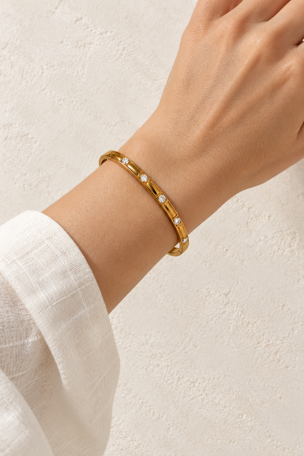 
                  
                    Model wearing Liora Gold Set Crystal Bangle
                  
                