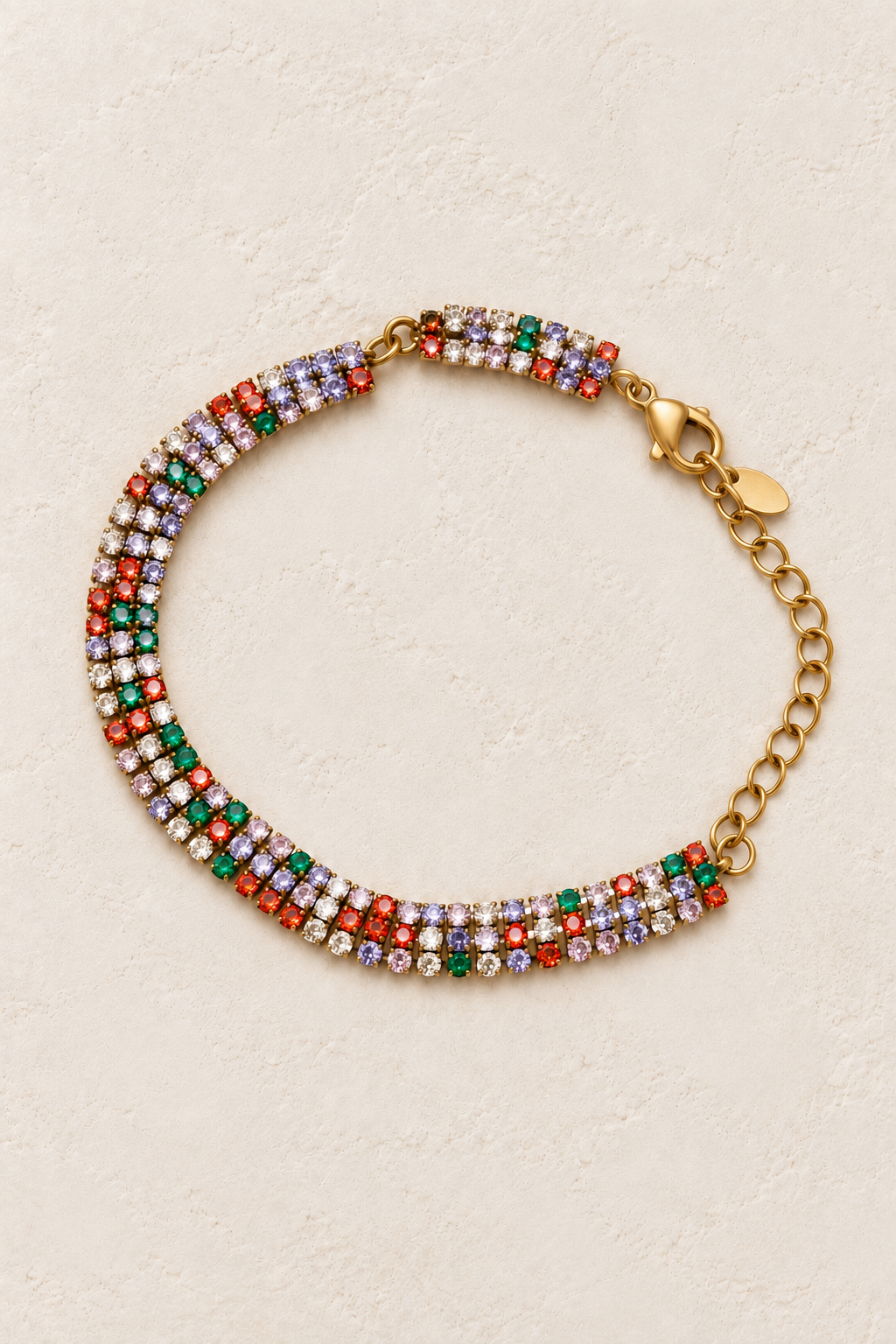 Luciana Gold Triple Row Multicolour Tennis Bracelet on a beige textured background