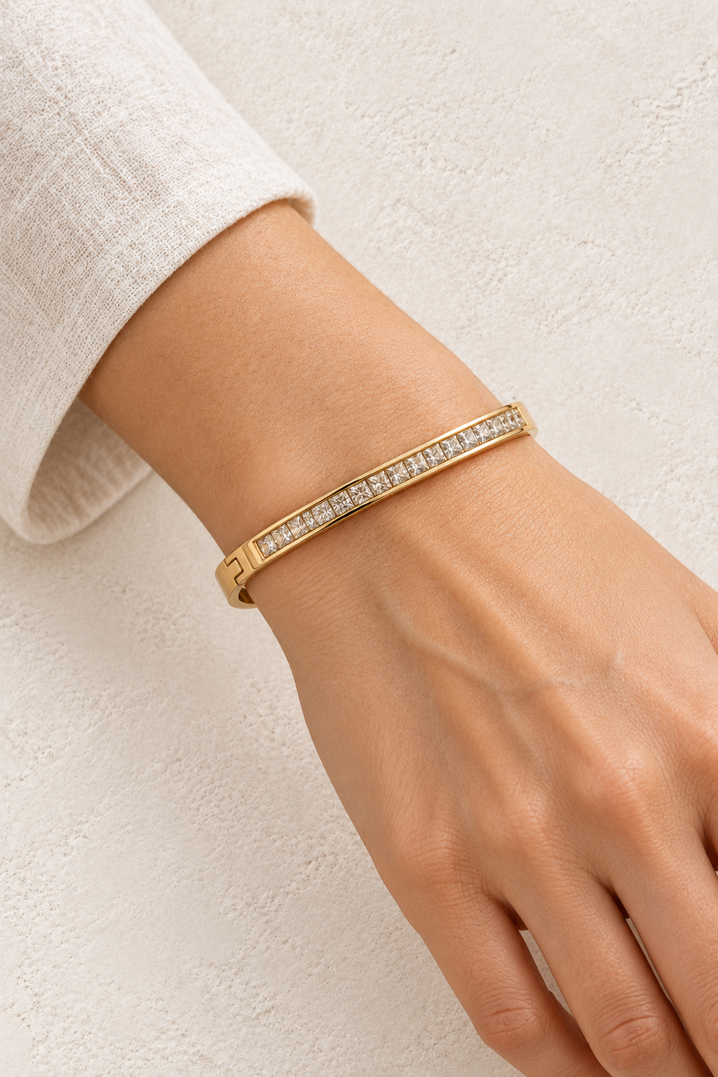 
                  
                    Model wearing Lumi Gold Pavé Bangle
                  
                