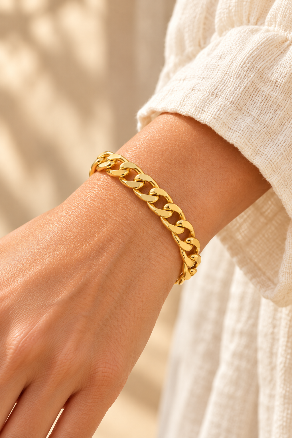 Luna Classic Oval Gold Bangle worn on a model's wrist