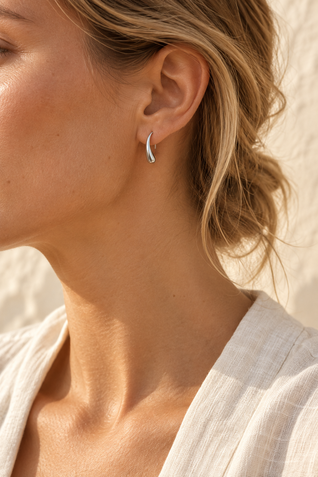 Model wearing Lune silver drop stud earring