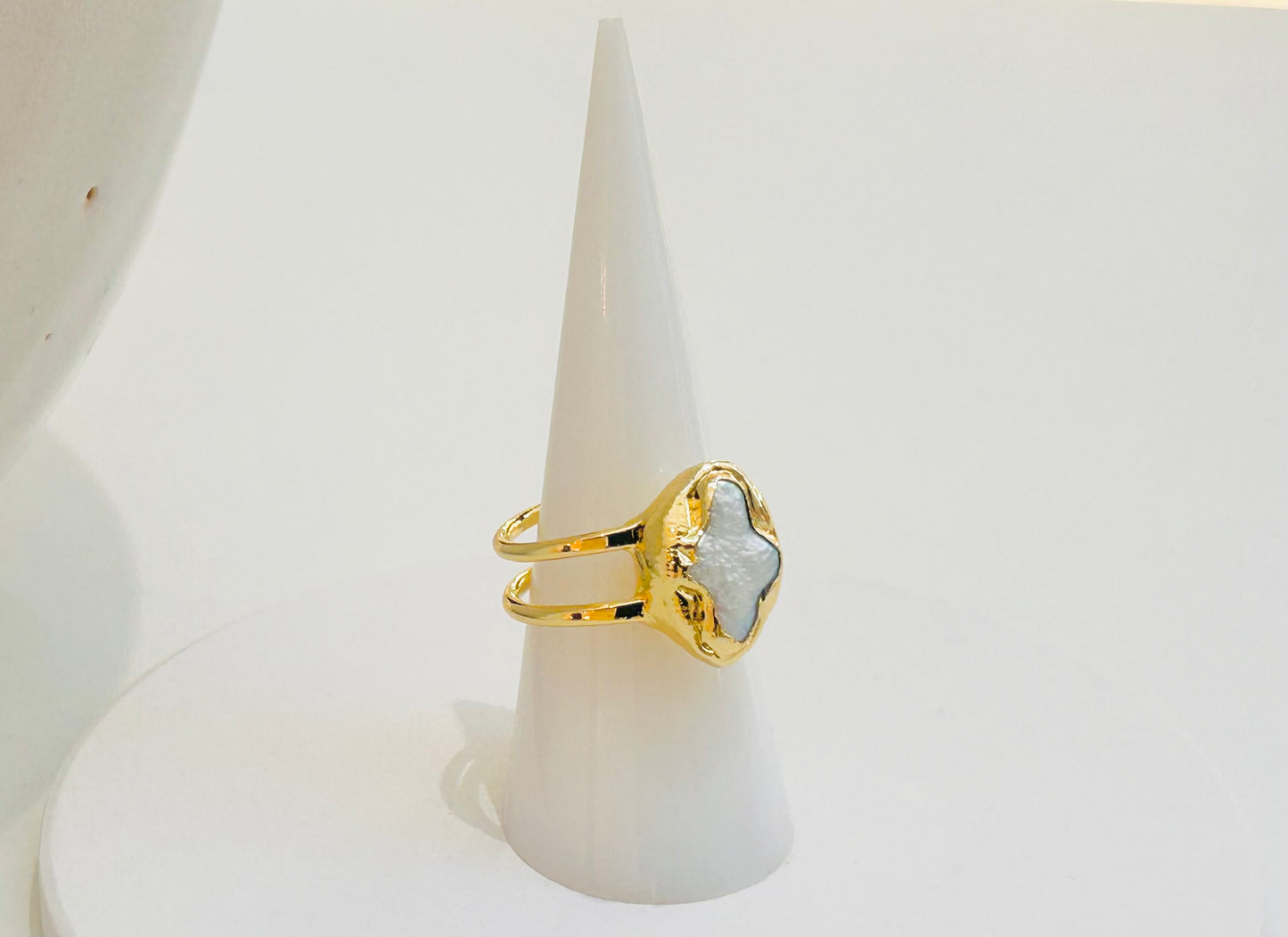 
                  
                    Lunessa Freshwater Pearl  Ring displayed on a white jewellery stand, featuring an organic pearl and crescent moon detail.
                  
                