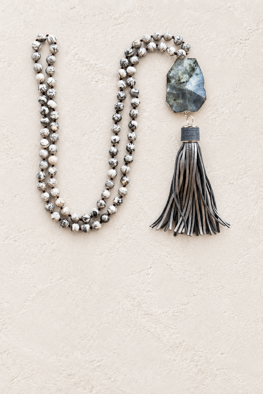 Map Stone & Labradorite Tassel Necklace on warm ivory plaster background
